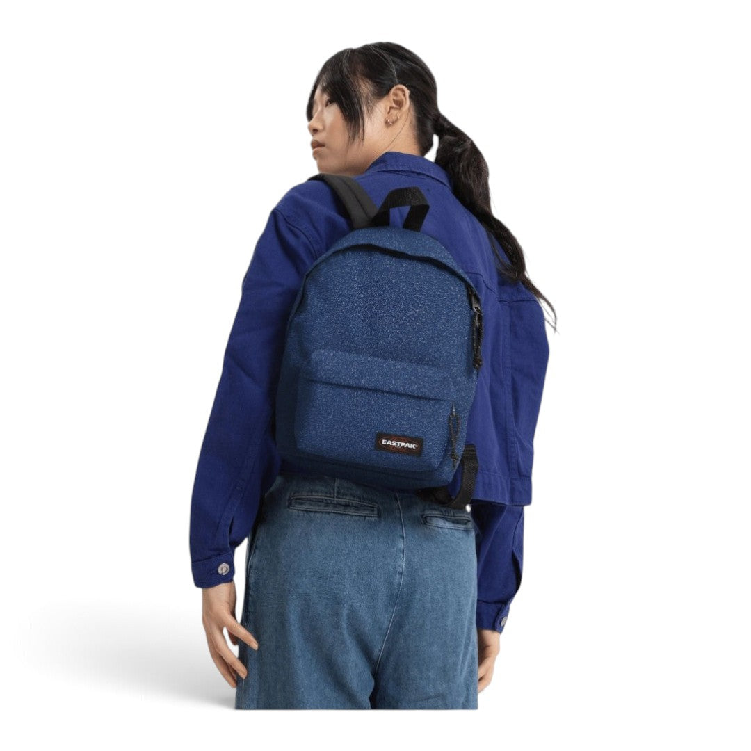 Woman wearing a blue glittery Eastpak Orbit Spark Charged mini backpack from Quiscuola.it – Zaini, Astucci e Diari Scuola
